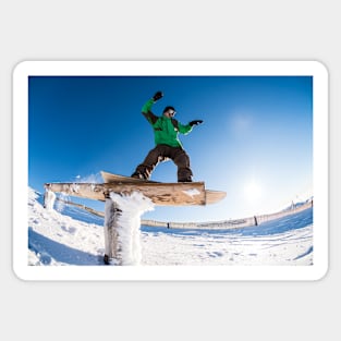 Snowboarder sliding on a rail Sticker